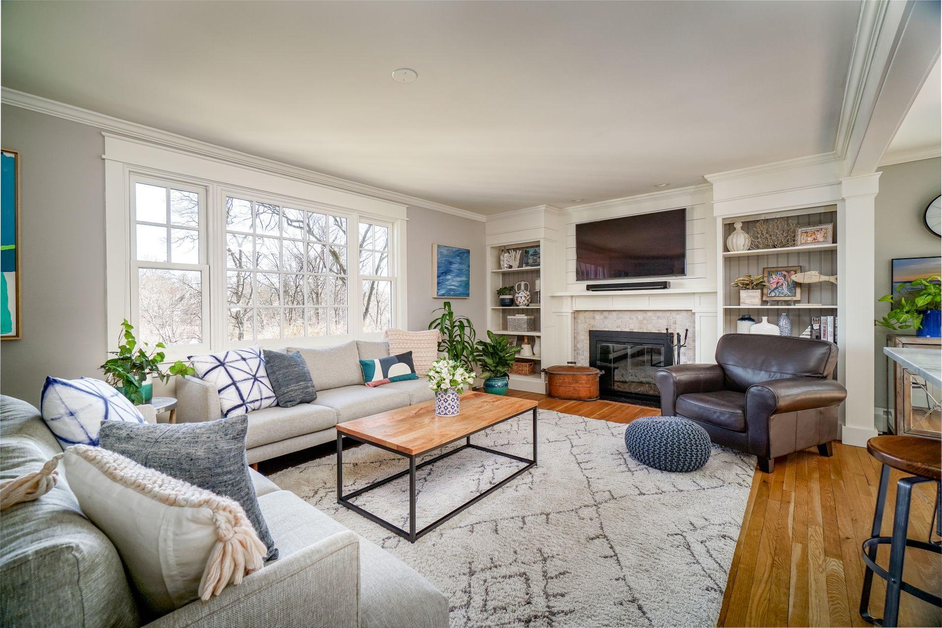 17 Steeple Top Road Rowayton, CT 06853 - Photo 6 of 37 a living room with furniture a fireplace and a flat screen tv