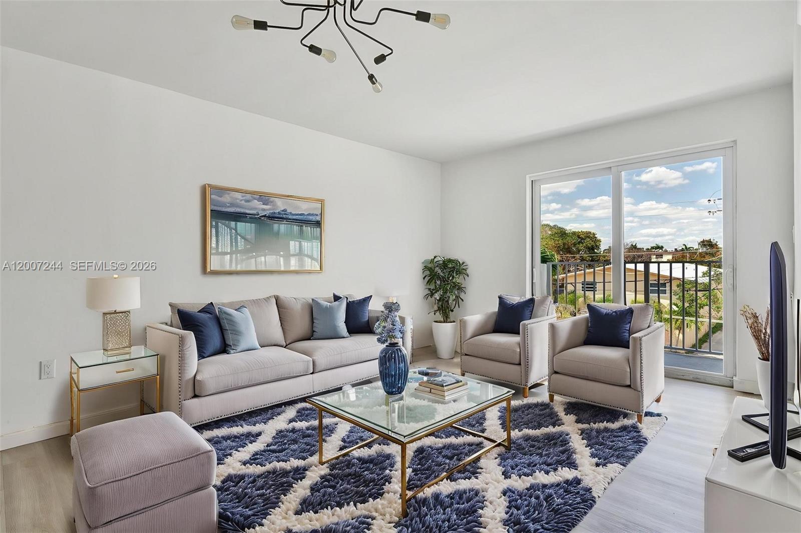 620 Southwest 10th Street, Unit 301 Miami, FL 33130 - Photo 3 of 20 a living room with furniture and a large window