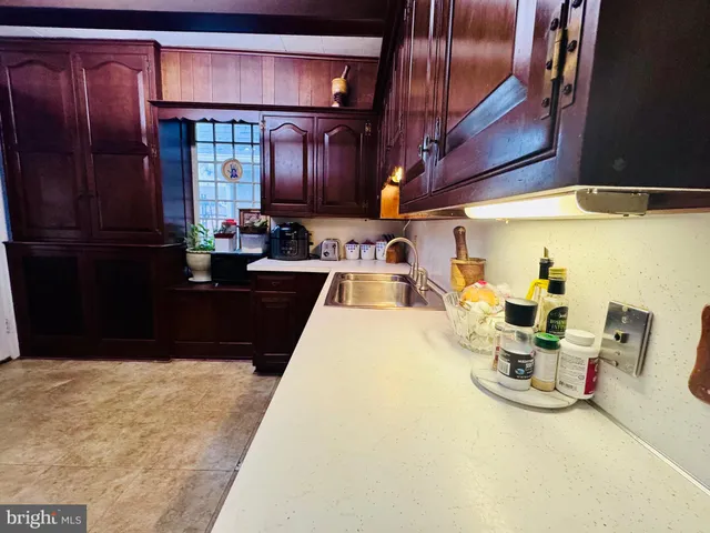 a kitchen with a sink and cabinets