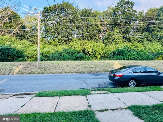 a view of street with parked cars