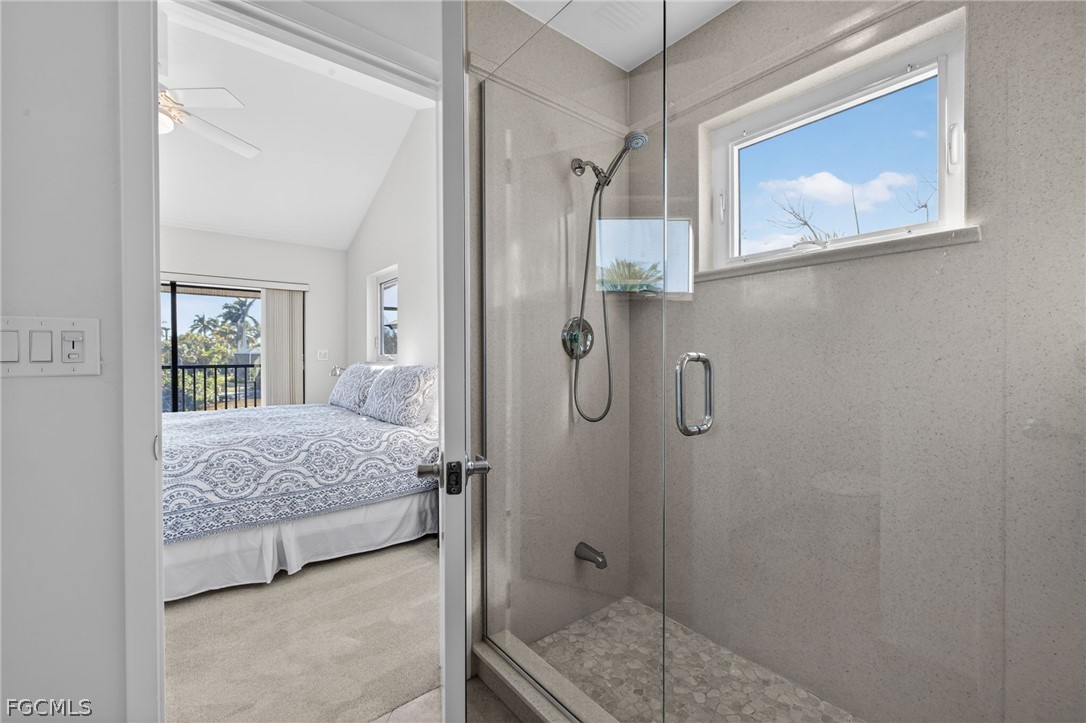 4562 Bowen Bayou Road Sanibel, FL 33957 - Photo 18 of 38 a bedroom with a bed and a bathroom