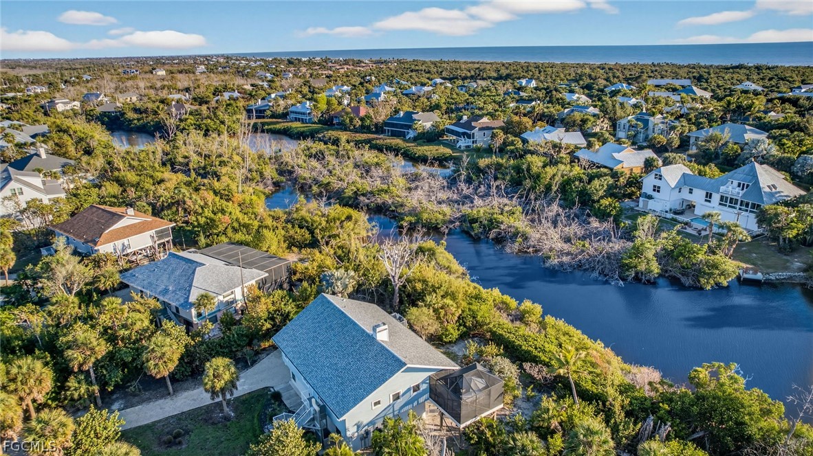 4562 Bowen Bayou Road Sanibel, FL 33957 - Photo 23 of 38 an aerial view of a house with a lake view