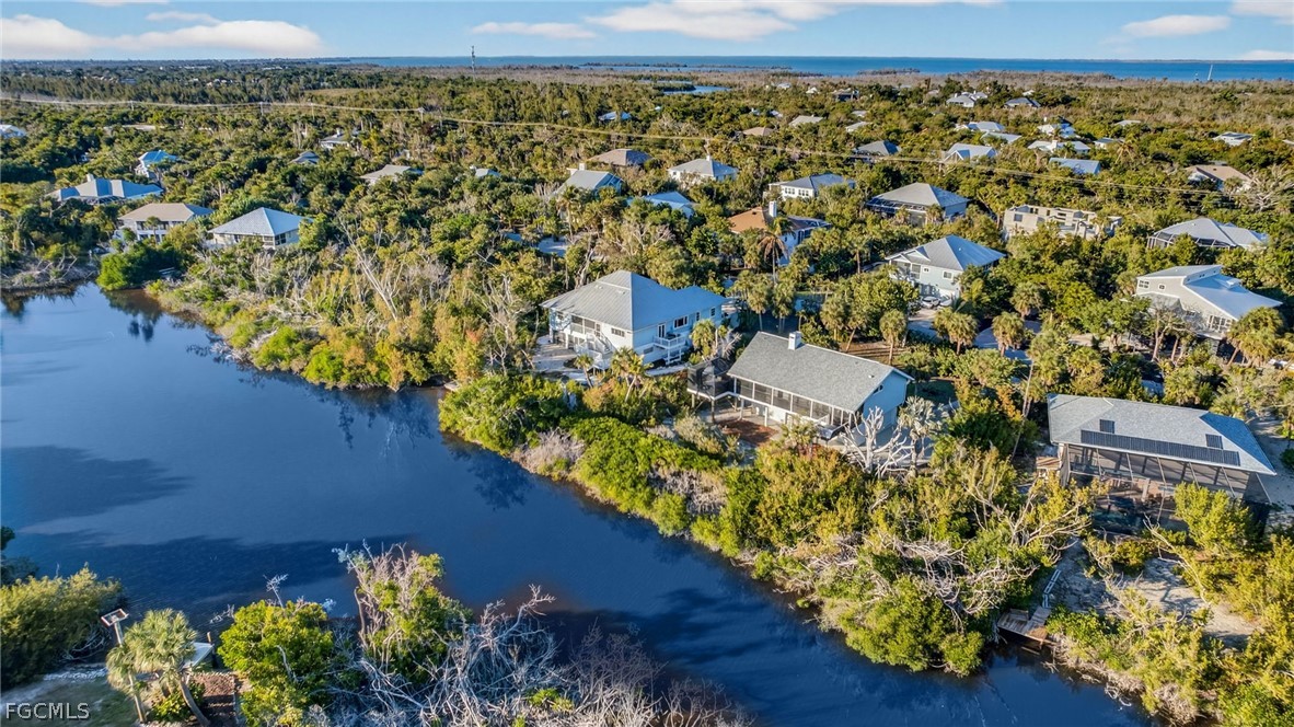 4562 Bowen Bayou Road Sanibel, FL 33957 - Photo 26 of 38 an aerial view of a house with a lake view