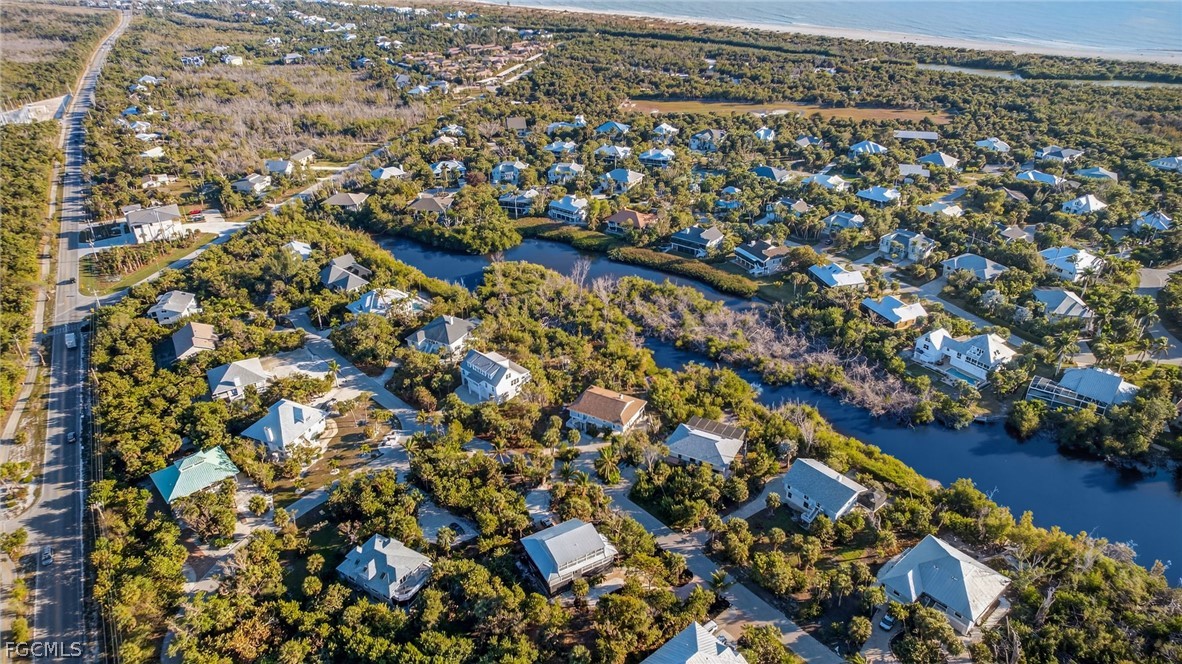 4562 Bowen Bayou Road Sanibel, FL 33957 - Photo 37 of 38 an aerial view of house with yard and mountain view in back