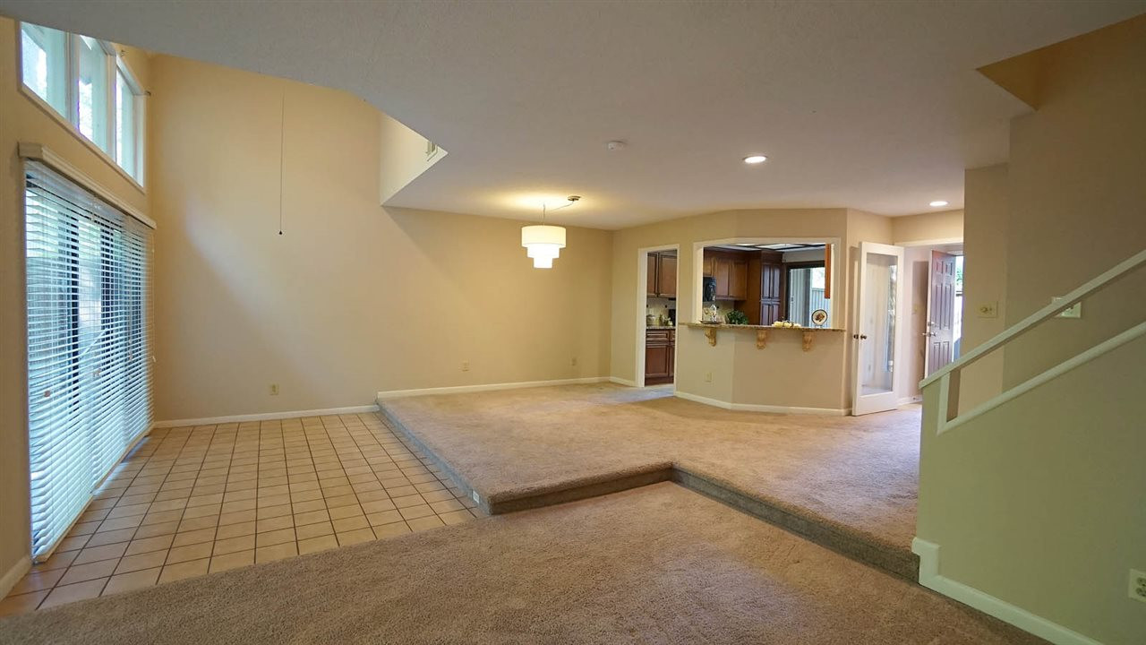 Sunken Sun Room has Ceramic Flooring + Sliding Glass Doors overlooking Totally Private Backyard. Sun Room