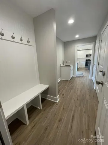 a view of a kitchen with wooden floor