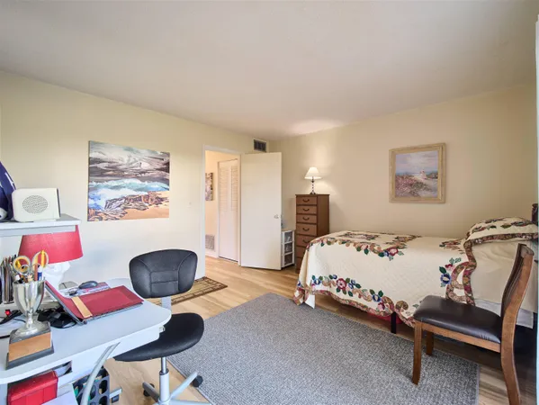 a bedroom with furniture and a window