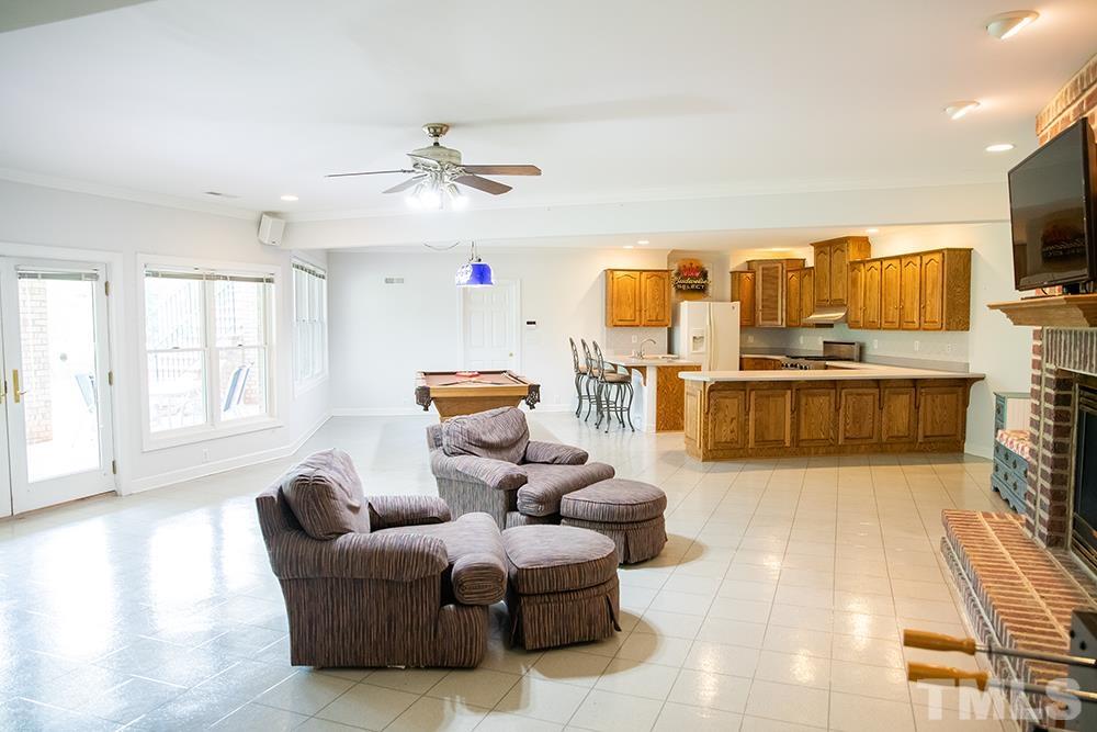 687 Ed Lester Road Roxboro, NC 27574 - Photo 44 of 63 a living room with furniture and a flat screen tv