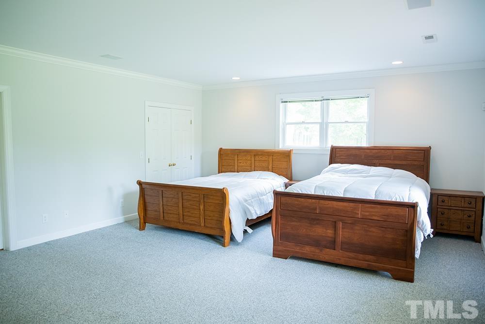 687 Ed Lester Road Roxboro, NC 27574 - Photo 54 of 63 a bedroom with a bed and a window