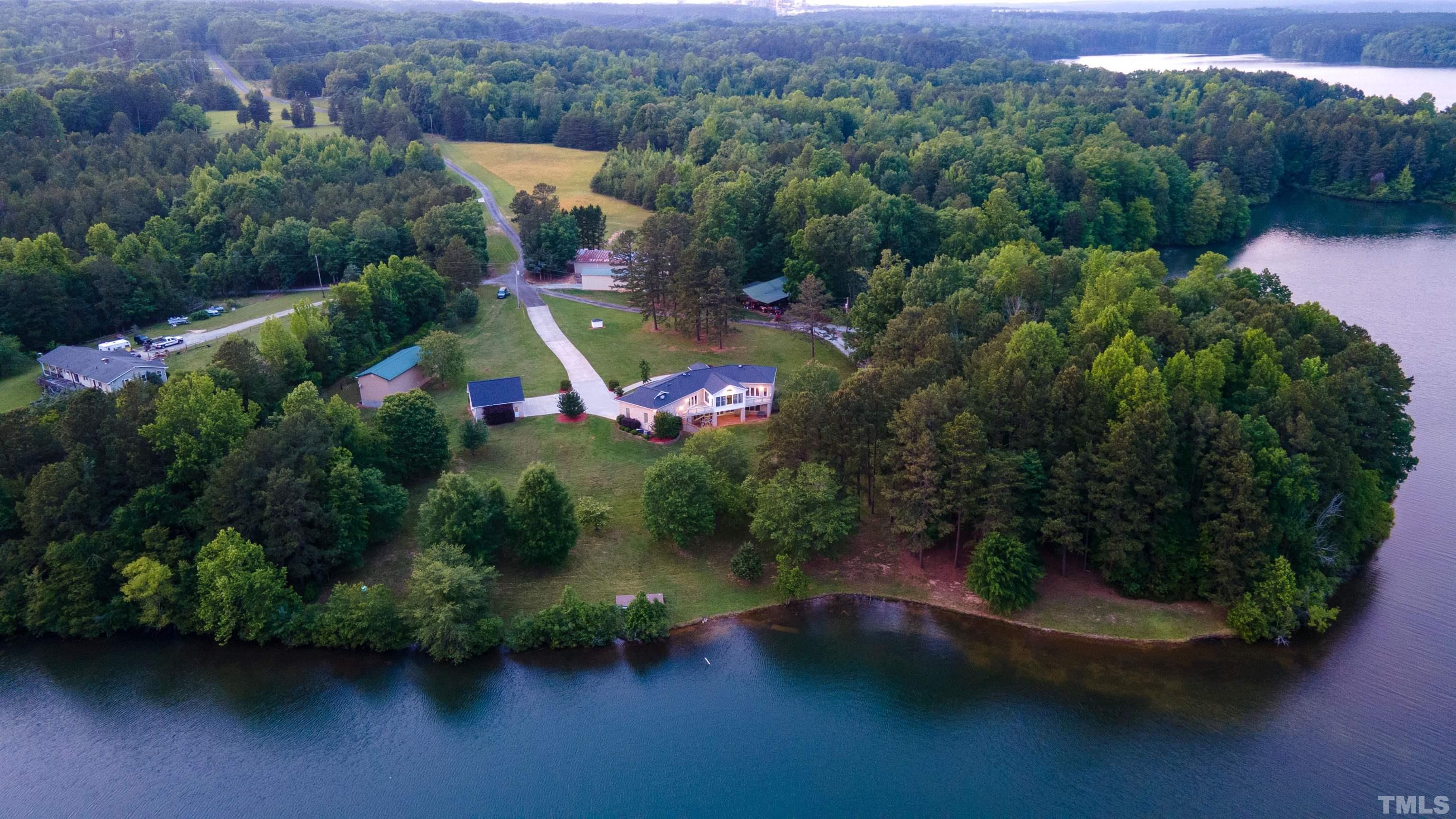 687 Ed Lester Road Roxboro, NC 27574 - Photo 9 of 63 an aerial view of a house with a yard lake and mountain view