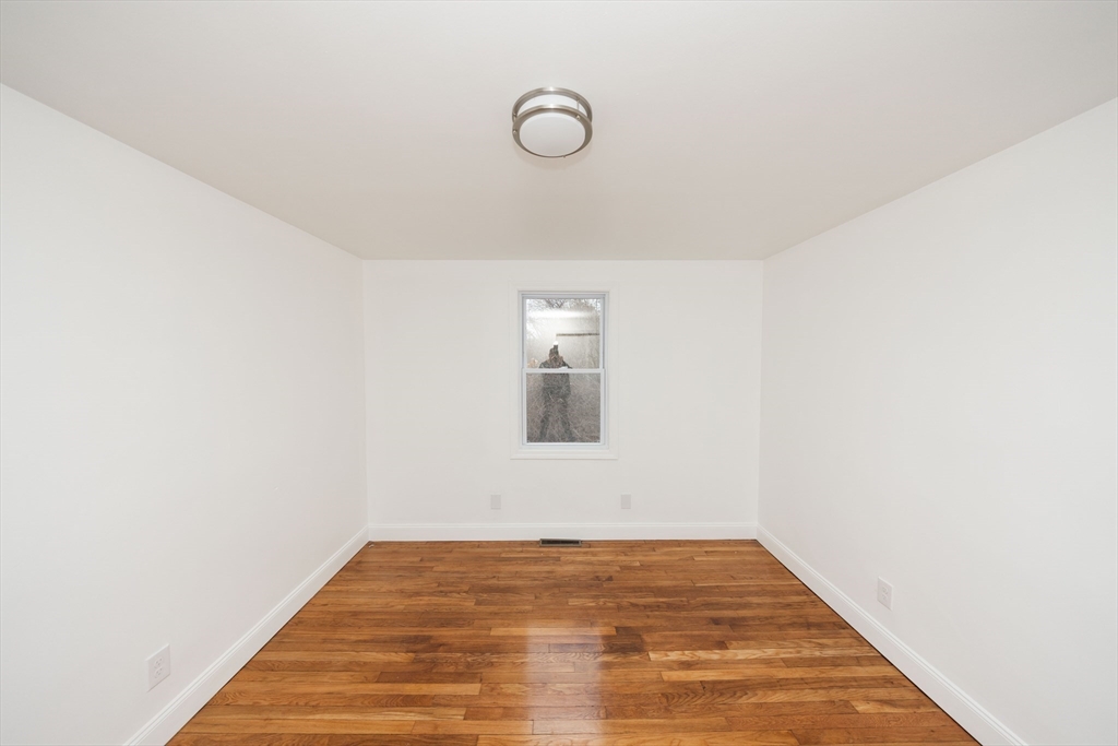 155 Southbridge Road Oxford, MA 01537 - Photo 13 of 39 a view of a room with wooden floor and white walls