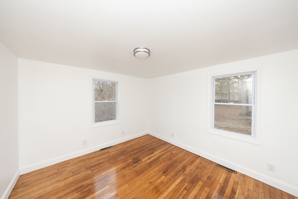 155 Southbridge Road Oxford, MA 01537 - Photo 14 of 39 an empty room with wooden floor and windows