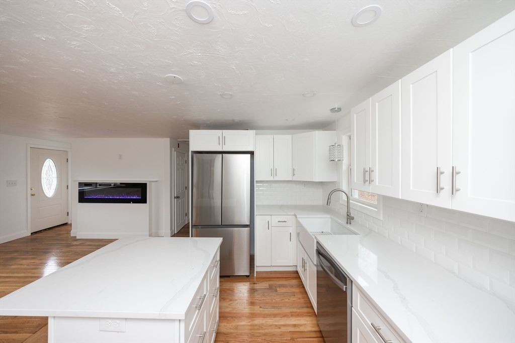 155 Southbridge Road Oxford, MA 01537 - Photo 2 of 39 a kitchen with a sink a refrigerator and a stove