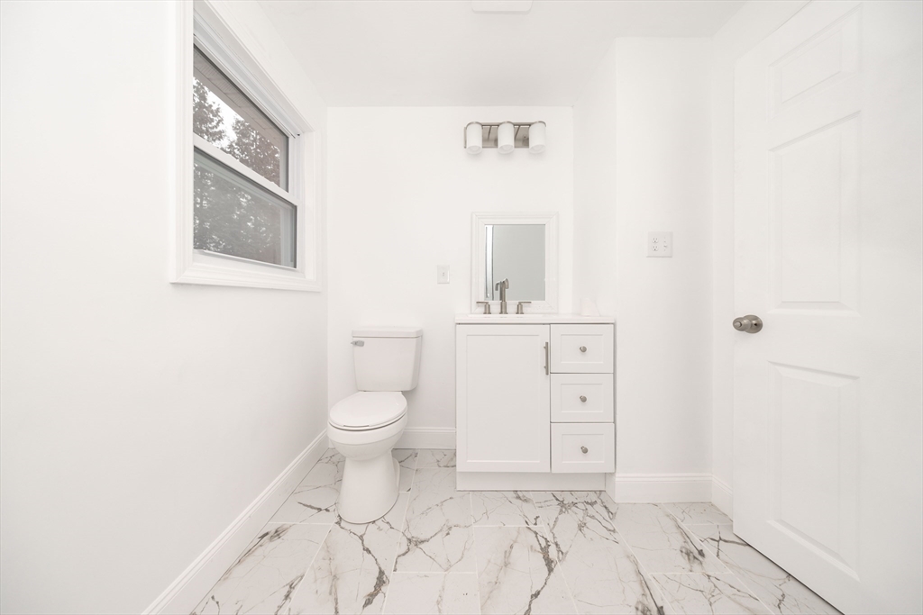 155 Southbridge Road Oxford, MA 01537 - Photo 22 of 39 a bathroom with a toilet sink and mirror
