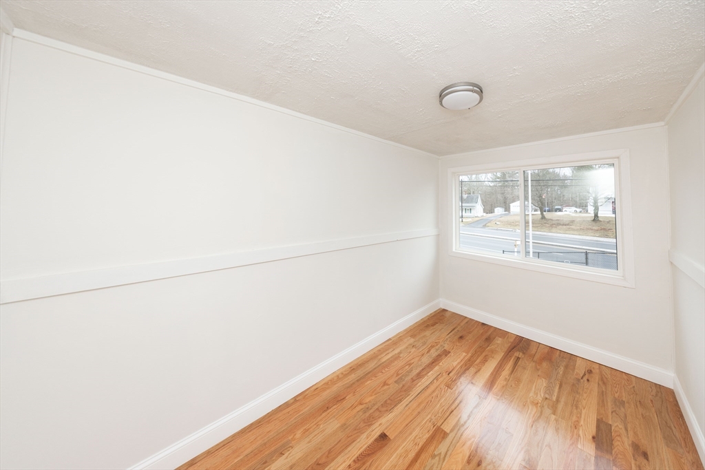155 Southbridge Road Oxford, MA 01537 - Photo 33 of 39 a view of a room with wooden floor and white walls