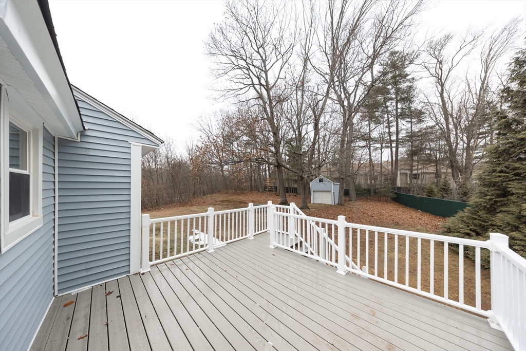 155 Southbridge Road Oxford, MA 01537 - Photo 34 of 39 a view of a wooden deck with a yard