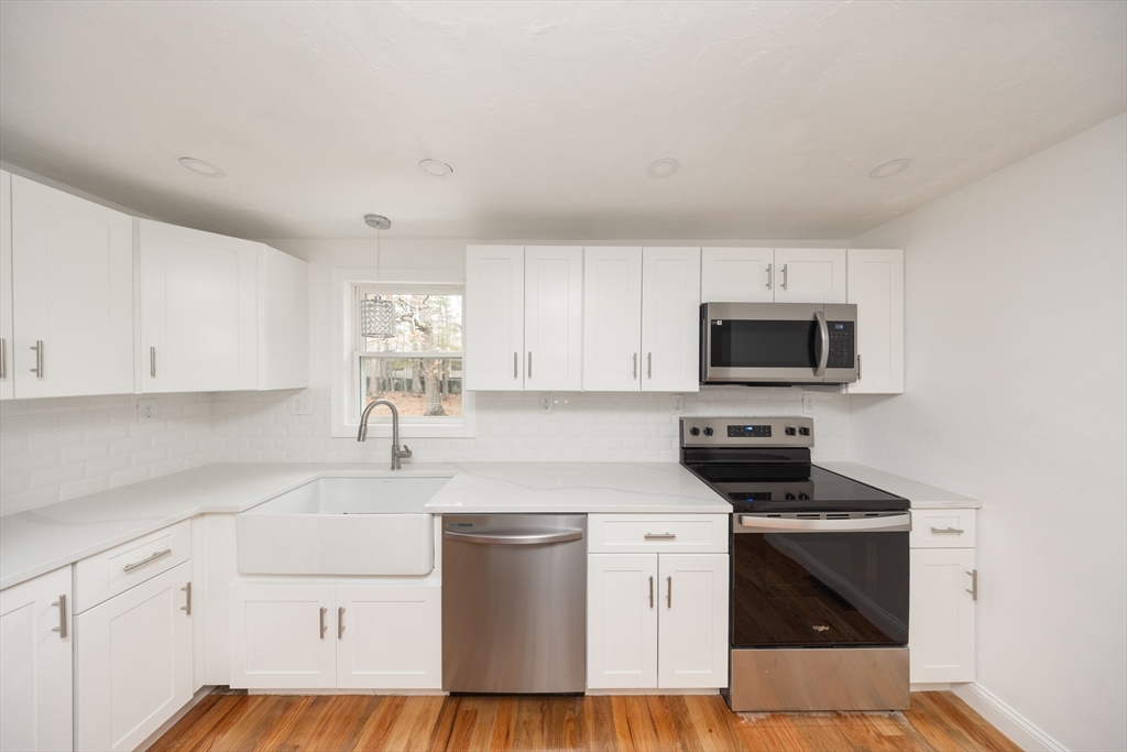 155 Southbridge Road Oxford, MA 01537 - Photo 5 of 39 a kitchen with stainless steel appliances a stove microwave and sink