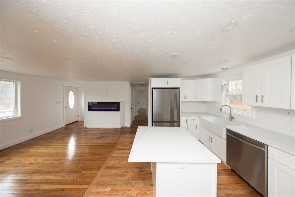 155 Southbridge Road Oxford, MA 01537 - Photo 6 of 39 a large kitchen with cabinets and wooden floor