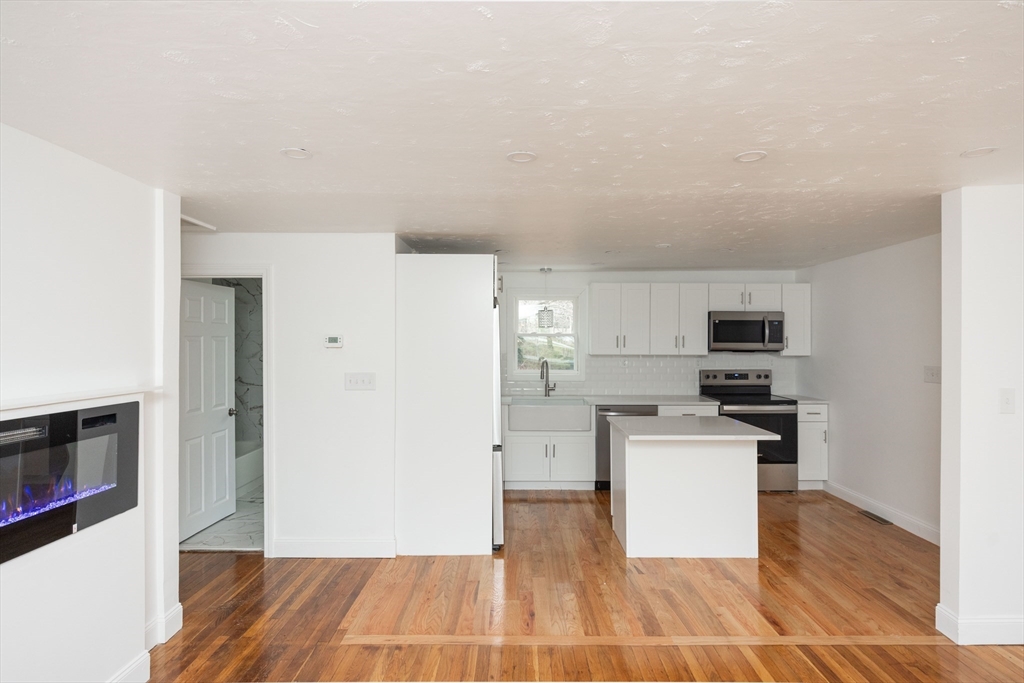 155 Southbridge Road Oxford, MA 01537 - Photo 7 of 39 a view of a kitchen with a sink stove cabinets and empty room