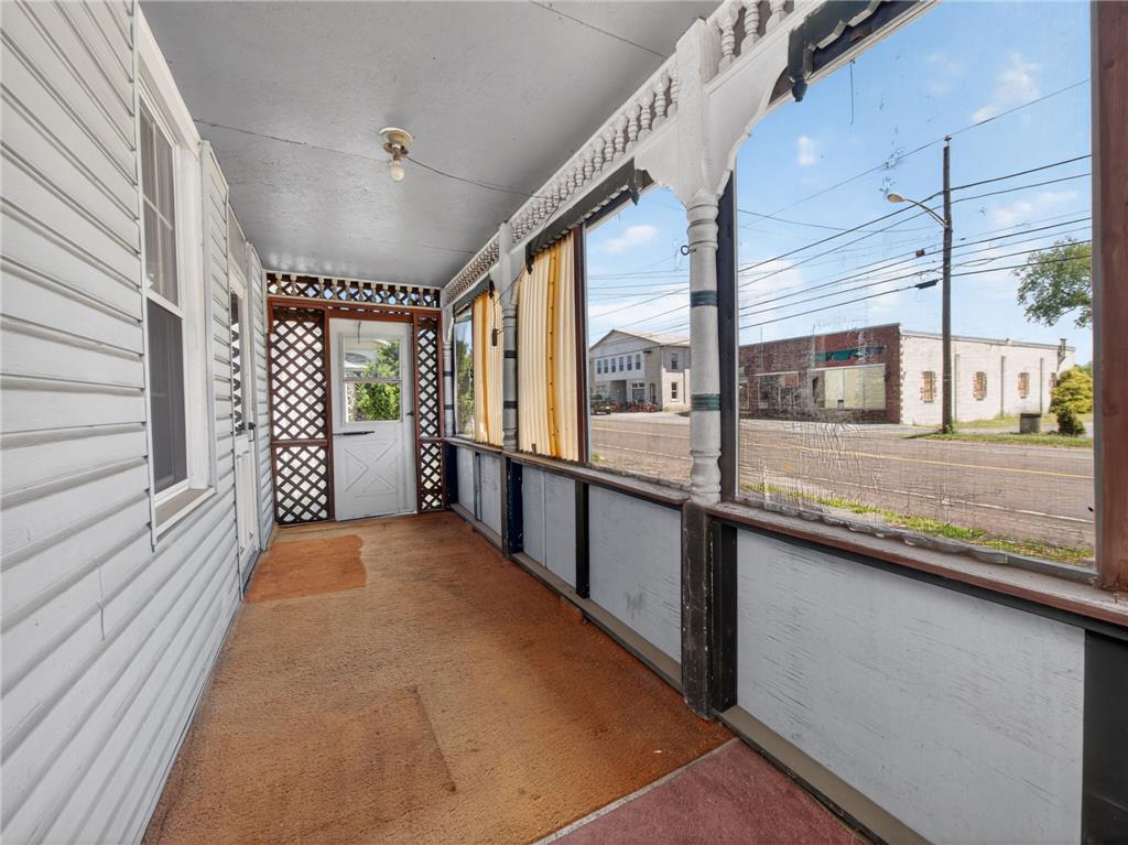 15845 Kutztown Road Mertztown, PA 19539 - Photo 20 of 24 A spacious covered porch offers a sheltered outdoor space with views of the street.