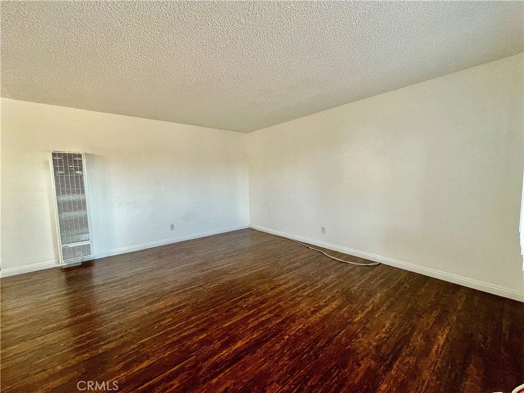 935 East Rte 66 Glendora, CA 91740 - Photo 2 of 10 a view of empty room with wooden floor