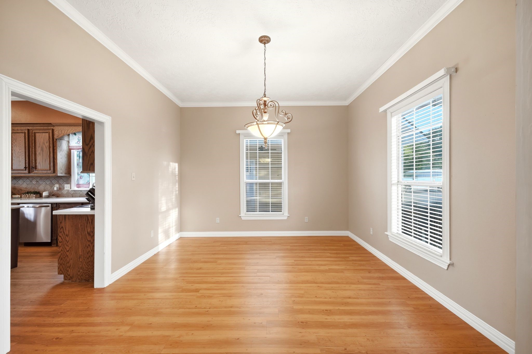 144 Wood Farm Road Huntsville, TX 77320 - Photo 12 of 50 a view of a room with wooden floor kitchen view and a window