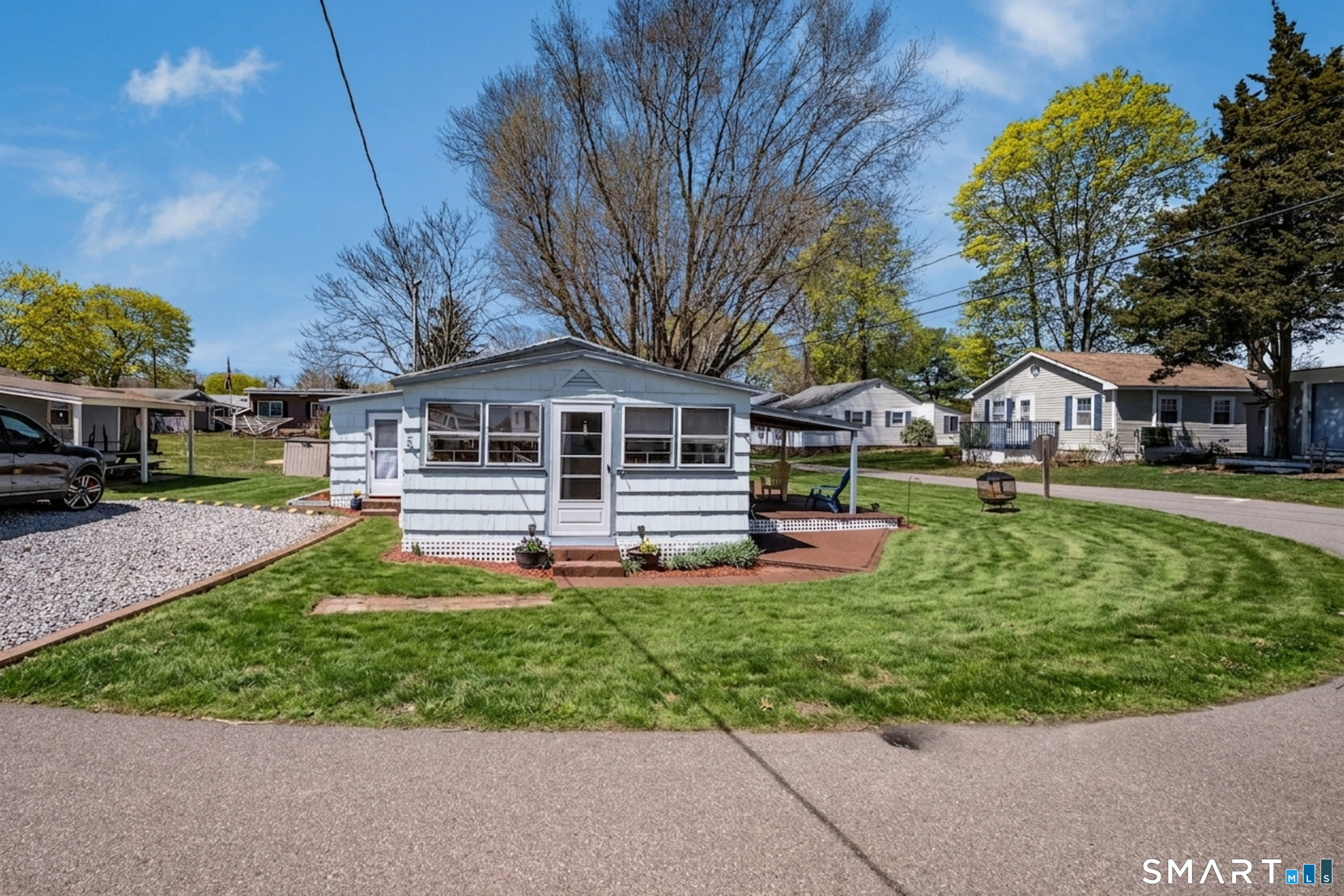 32 North Street Madison, CT 06443 - Photo 2 of 20 Lovely corner lot, one of the largest in the complex. Grass enhanced