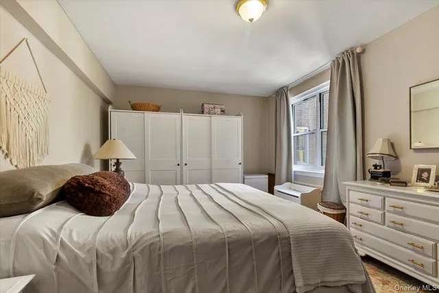 a bedroom with a bed and a closet