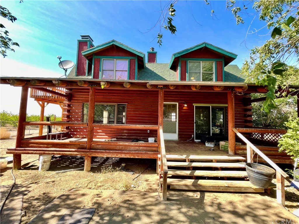 3832 Cruidup Road Phelan, CA 92371 - Photo 1 of 1 a view of a house with a roof deck