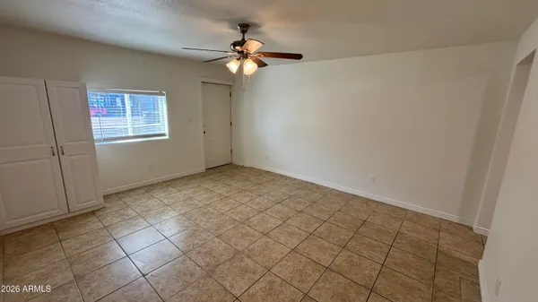 a view of an empty room with a window