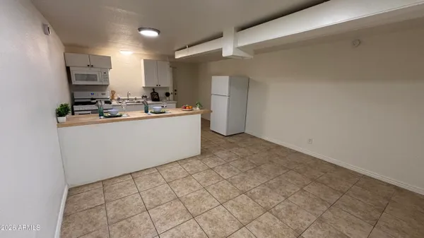 a kitchen with stainless steel appliances a sink stove and cabinets