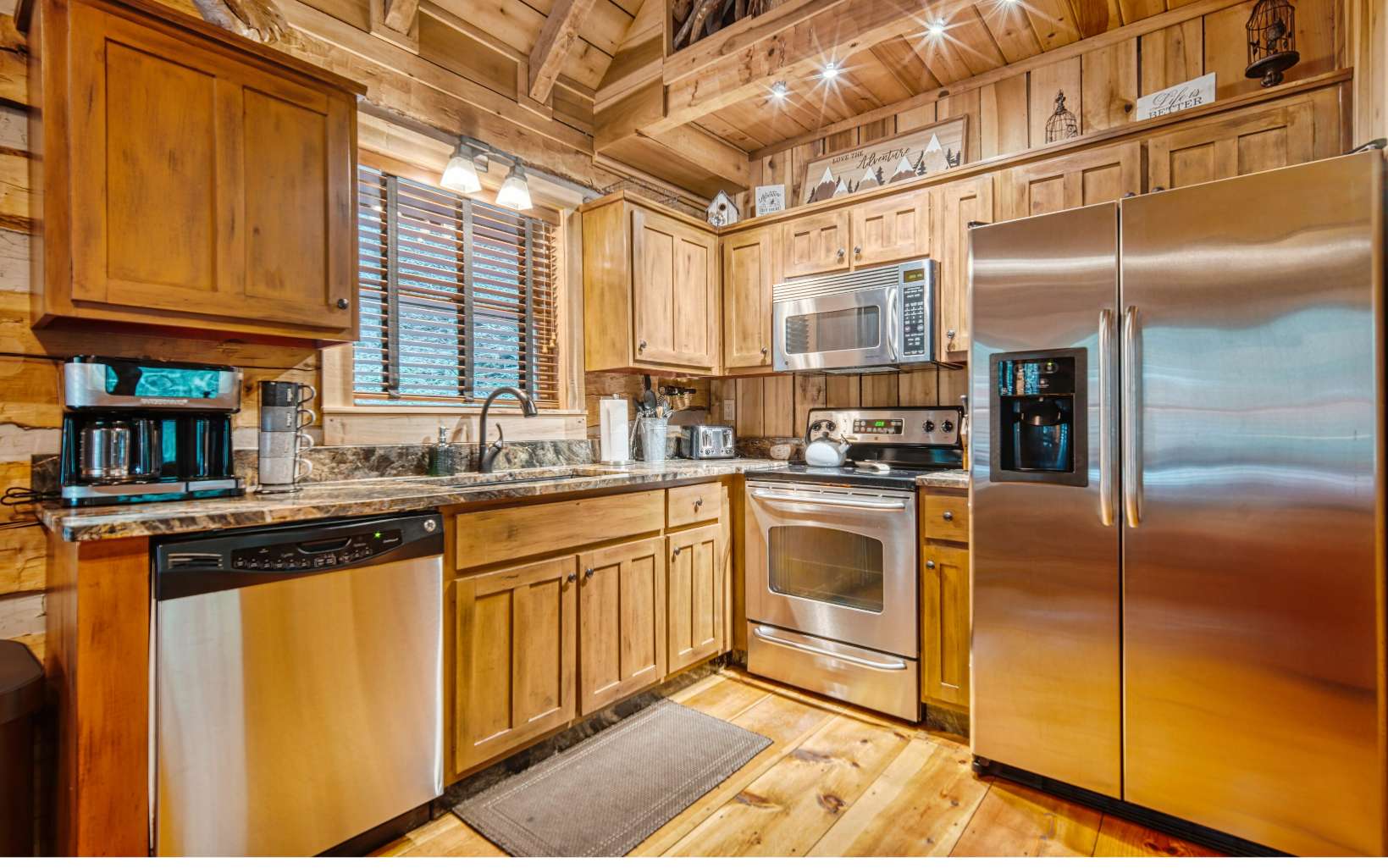 889 Joann Sisson Road Blue Ridge, GA 30513 - Photo 16 of 41 a kitchen with granite countertop stainless steel appliances a sink and cabinets