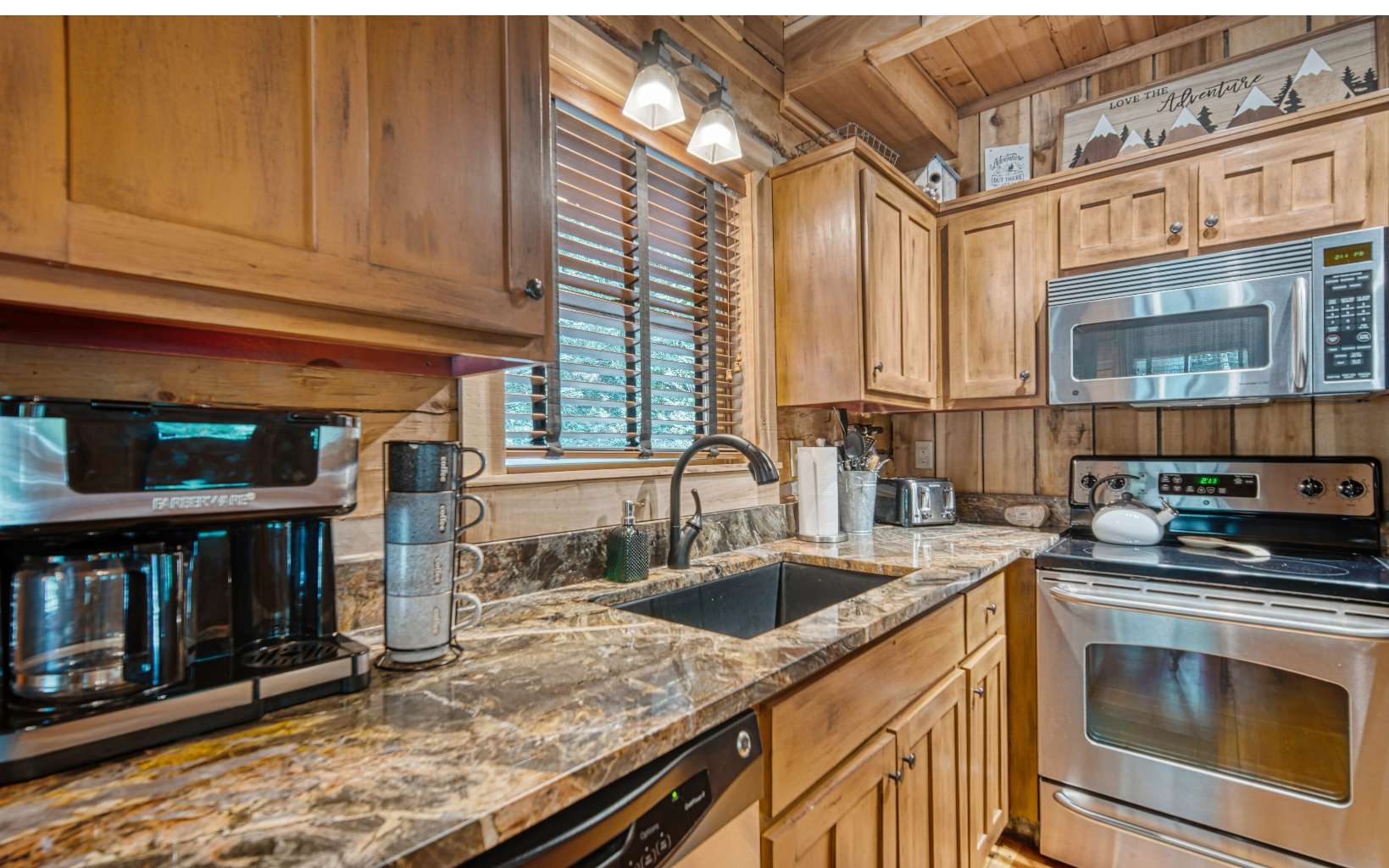 889 Joann Sisson Road Blue Ridge, GA 30513 - Photo 5 of 41 a kitchen that has a sink and a stove