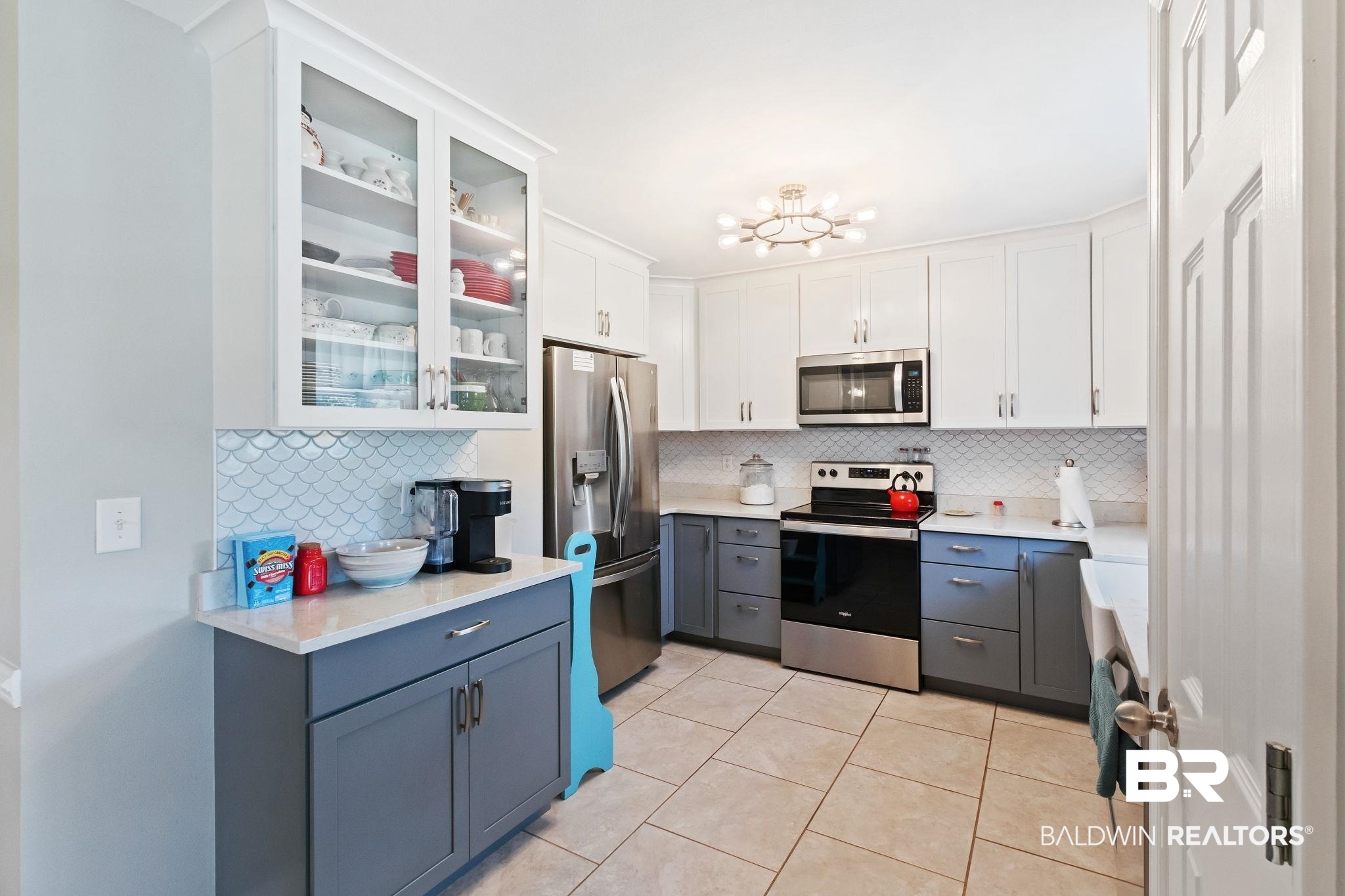 16898 Sugar Loop Foley, AL 36535 - Photo 19 of 67 Kitchen featuring white cabinetry, tasteful backsplash, light tile patterned floors, gray cabinets, and appliances with stainless steel finishes