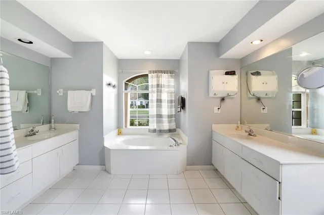 a bathroom with a bathtub and a sink