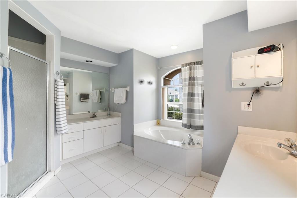 1920 Piccadilly Circus Naples, FL 34112 - Photo 18 of 25 a bathroom with a bathtub and a sink