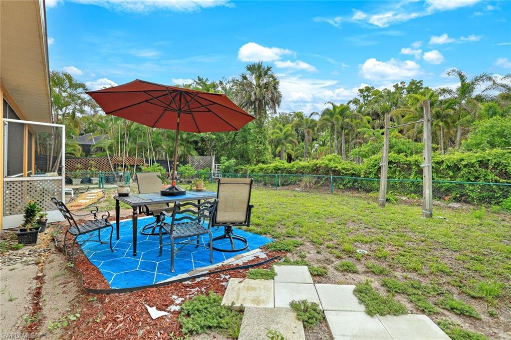 1920 Piccadilly Circus Naples, FL 34112 - Photo 24 of 25 a view of a backyard with sitting area