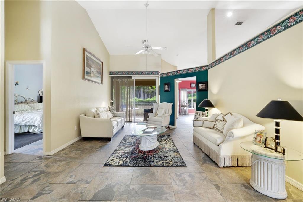 1920 Piccadilly Circus Naples, FL 34112 - Photo 6 of 25 a living room with furniture and a large window