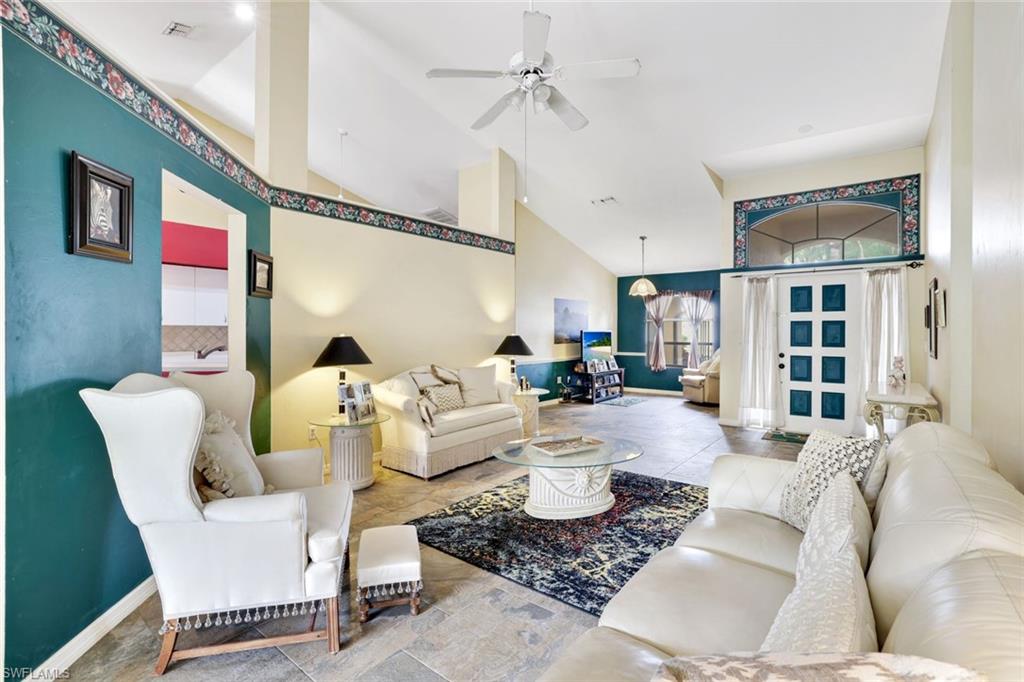 1920 Piccadilly Circus Naples, FL 34112 - Photo 9 of 25 a living room with furniture and a chandelier