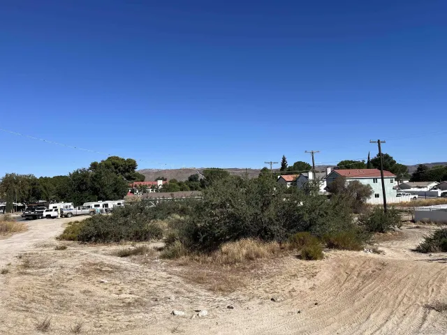 a view of a town with palm trees