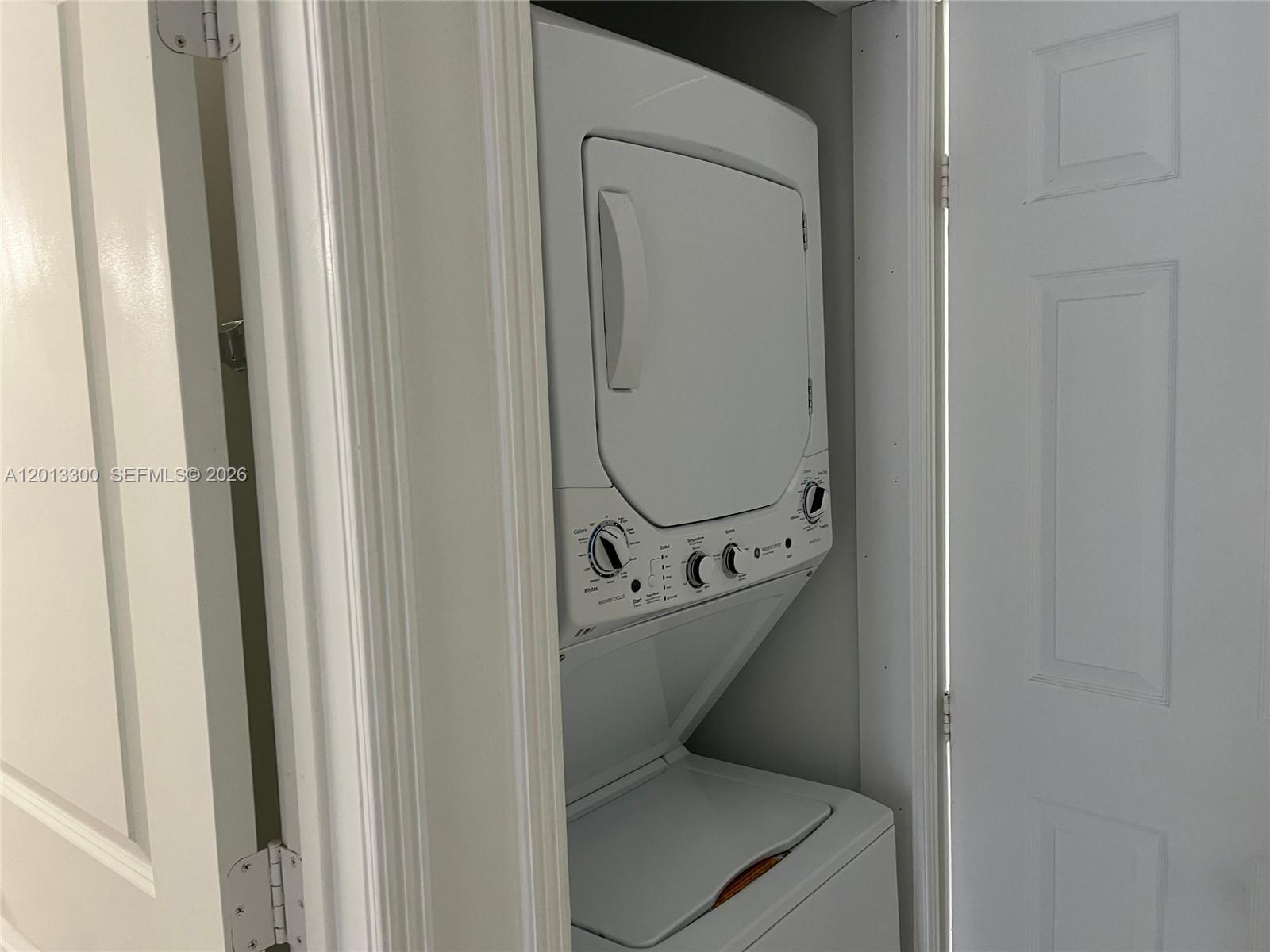 1020 Southwest 4th Street, Unit 102 Miami, FL 33130 - Photo 13 of 14 a bathroom with a sink toilet and a mirror