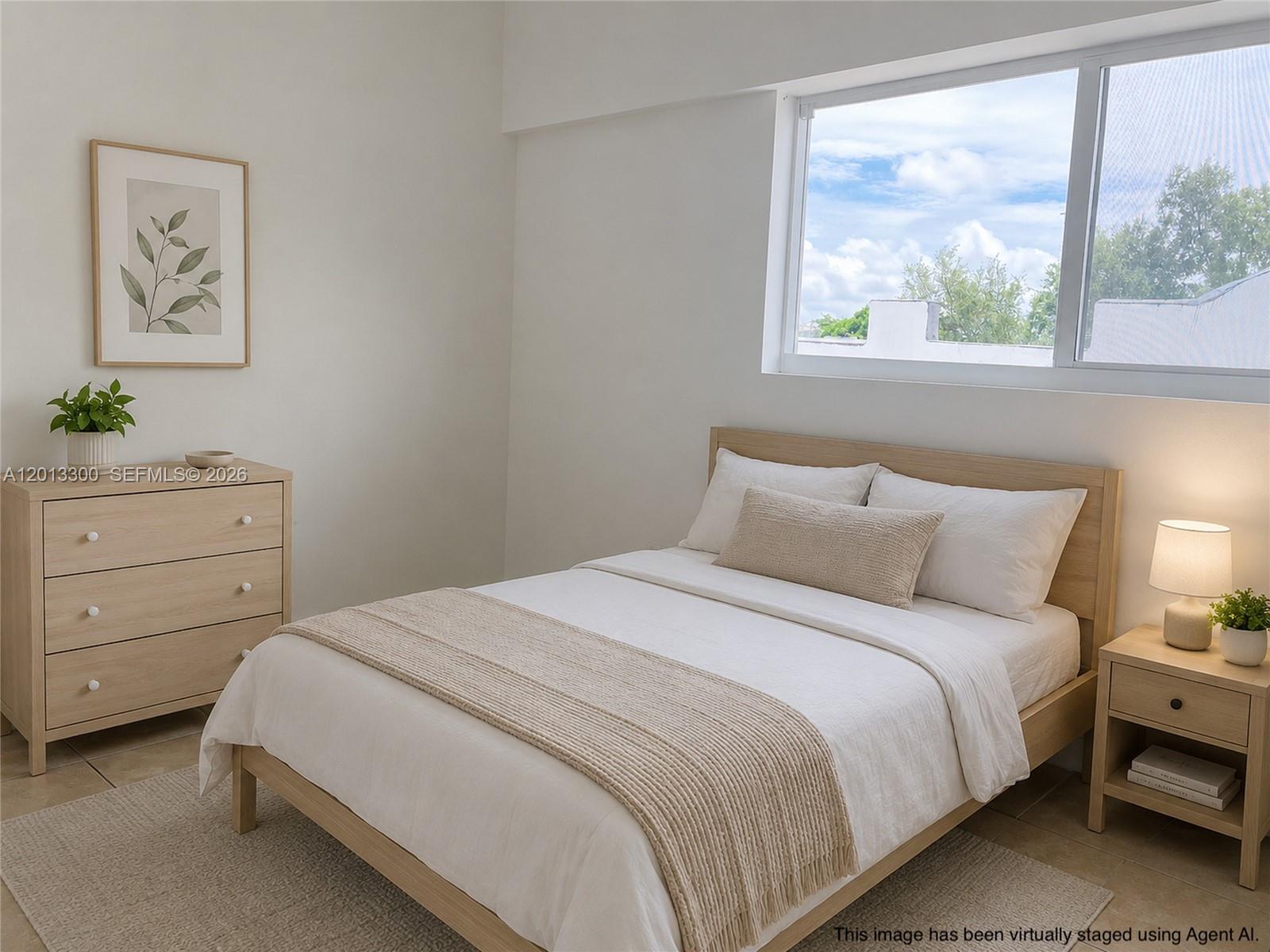 1020 Southwest 4th Street, Unit 102 Miami, FL 33130 - Photo 14 of 14 a bedroom with a bed and a window