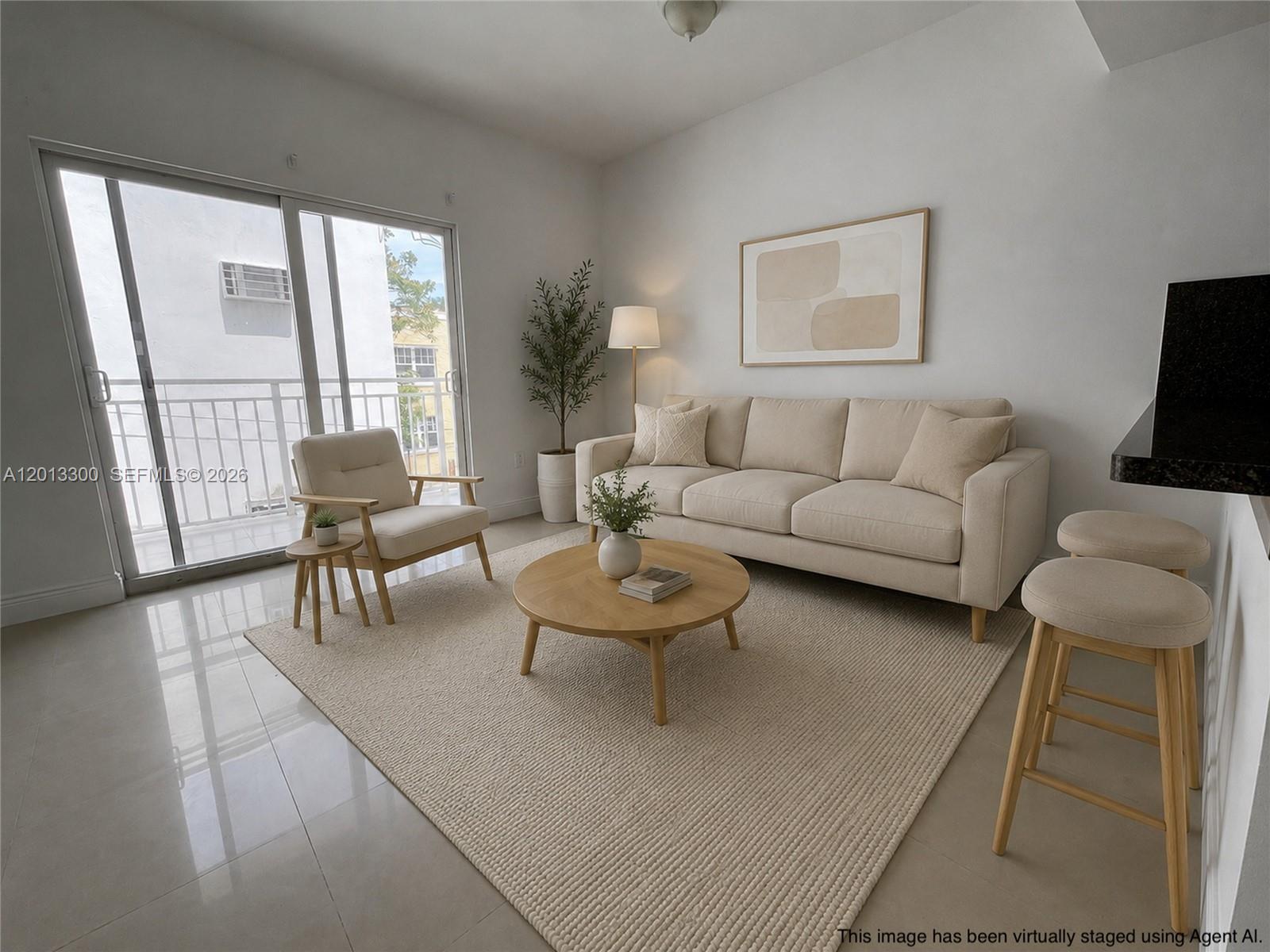 1020 Southwest 4th Street, Unit 102 Miami, FL 33130 - Photo 3 of 14 a living room with furniture and a large window