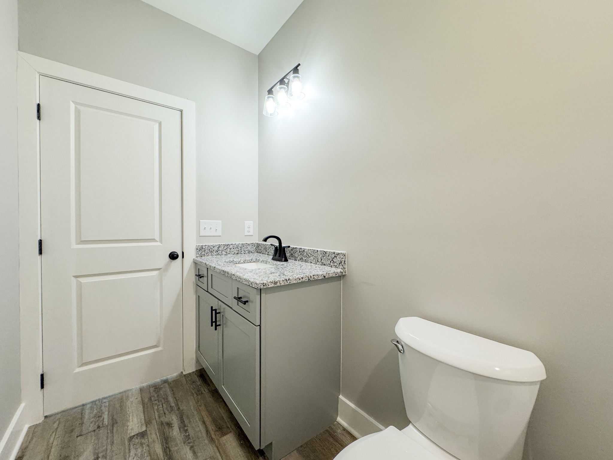181 Rock House Hollow Road Bethpage, TN 37022 - Photo 34 of 51 a bathroom with a toilet a sink and mirror