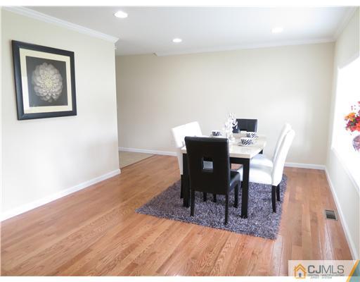 10 James Road East Brunswick, NJ 08816 - Photo 3 of 15 a workspace with furniture and wooden floor