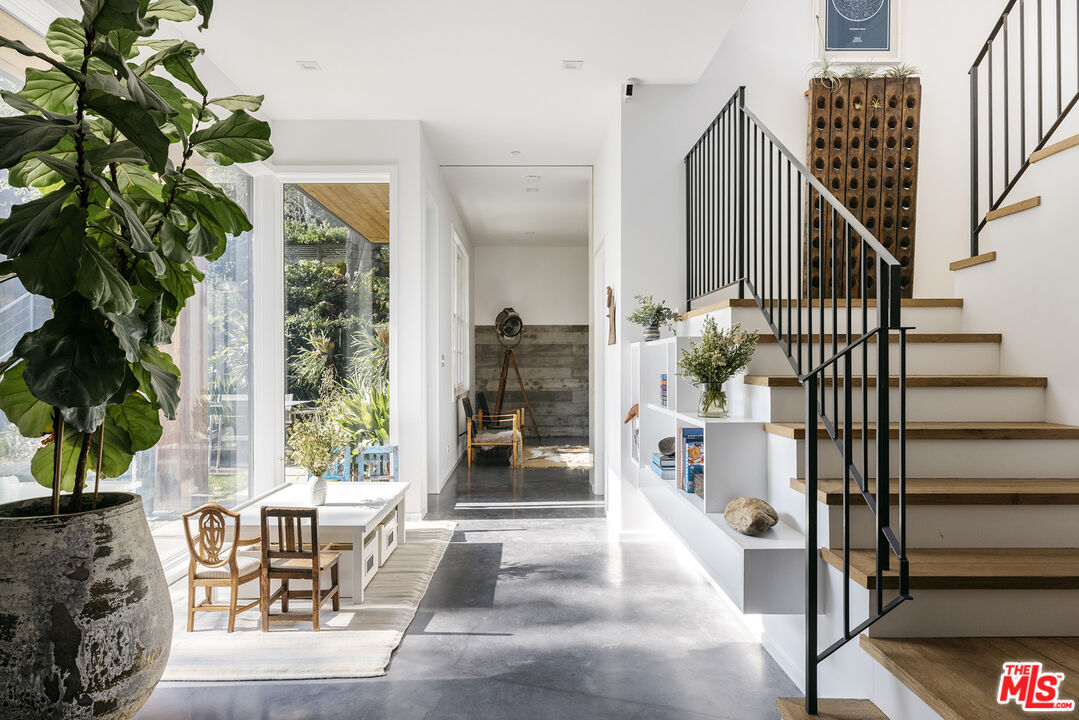 461 West Rustic Road Santa Monica, CA 90402 - Photo 13 of 31 a living room with furniture and a potted plant