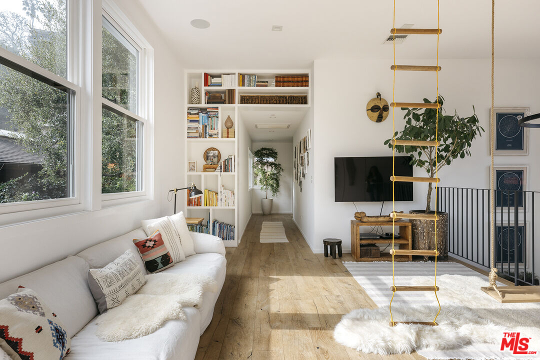 461 West Rustic Road Santa Monica, CA 90402 - Photo 16 of 31 a living room with furniture and a flat screen tv