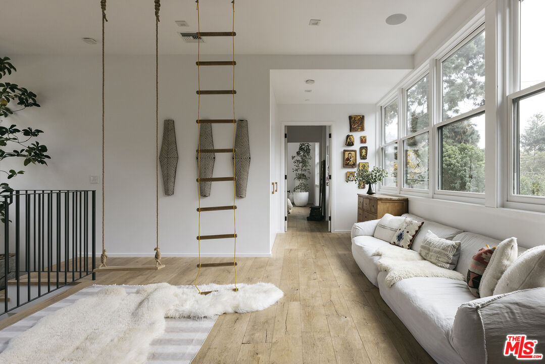 461 West Rustic Road Santa Monica, CA 90402 - Photo 22 of 31 a living room with furniture and a fireplace