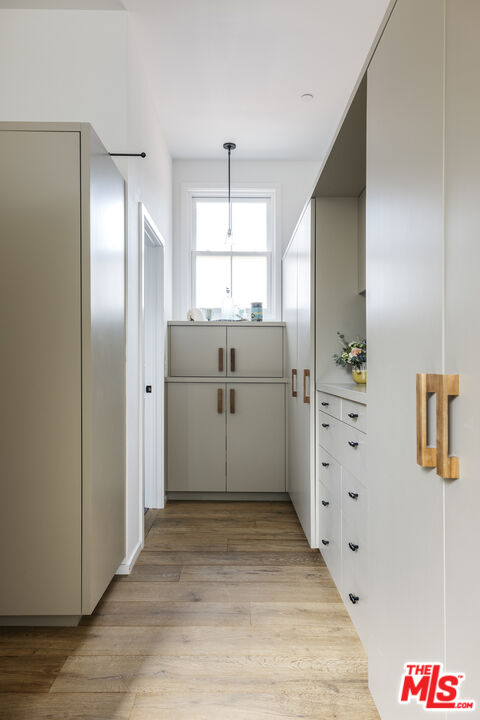 461 West Rustic Road Santa Monica, CA 90402 - Photo 25 of 31 a kitchen with granite countertop a refrigerator and a sink