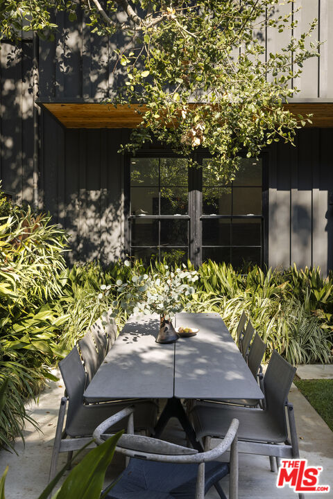 461 West Rustic Road Santa Monica, CA 90402 - Photo 29 of 31 a view of a chairs and table in a backyard
